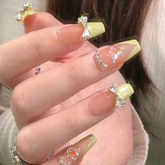 Yickyue 24Pcs Three-dimensional Love Heart False Nails with French Design Long Coffin Wearable Fake Nails Rhinestone Press on Nails Tips