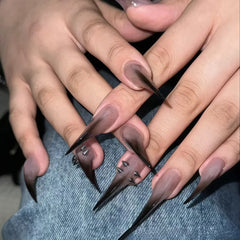 YICKYUE  -  10PCS of ultra-long pointed artificial nails, in black gradient color with metallic pointed decorations on the surface.